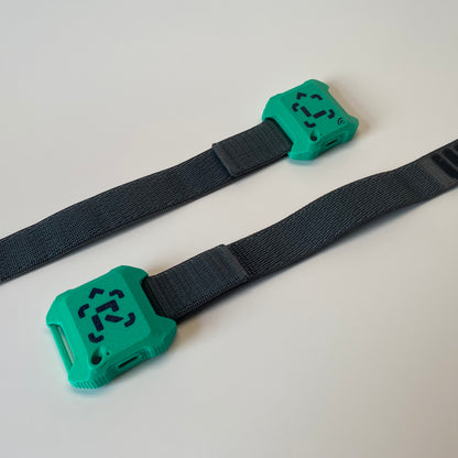 Left and right wrist boxing sensor. Green color, gray strap